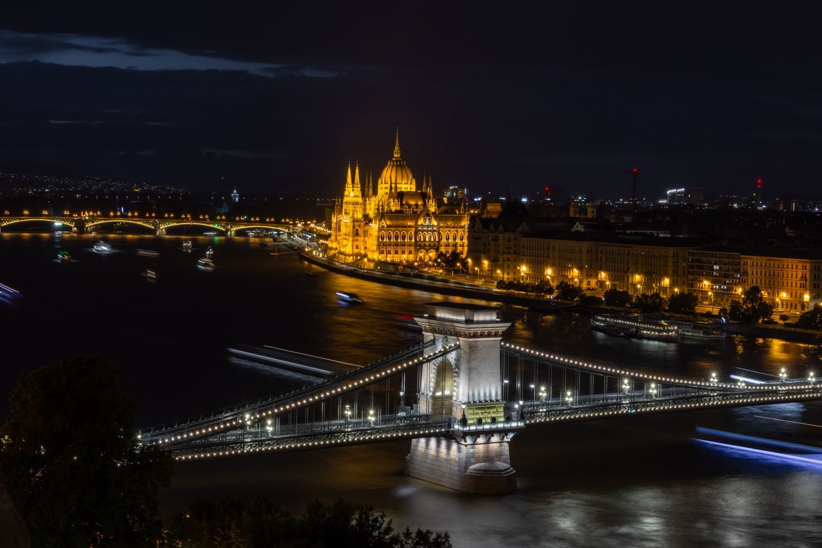 Chain Bridge and the Hungarian Parliament lit up over the Danube at night, a highlight of the world&rsquo;s best river cruises